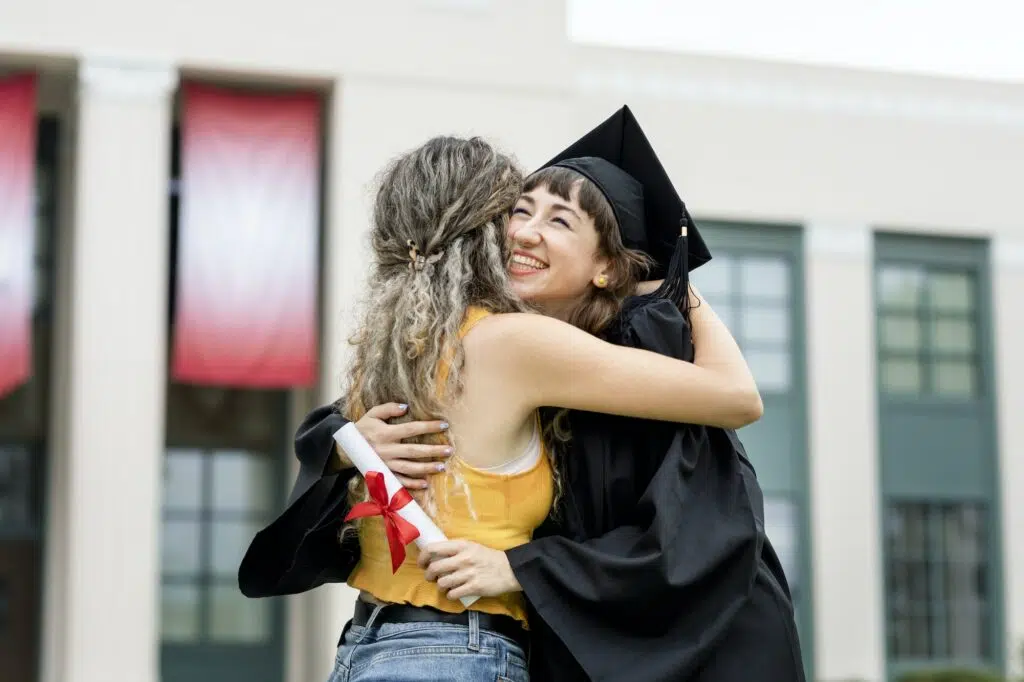 friends-hugging-at-graduation-ceremony.jpg